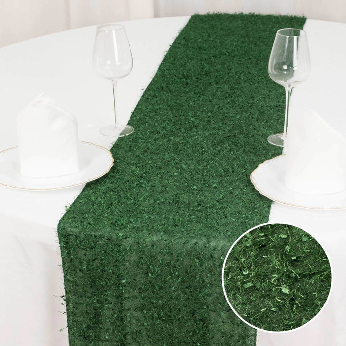 Green table runner with textured design on a dining table setting.