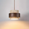 TerraHalo pendant lit, hanging from ceiling showing travertine and walnut wood two-tier shade