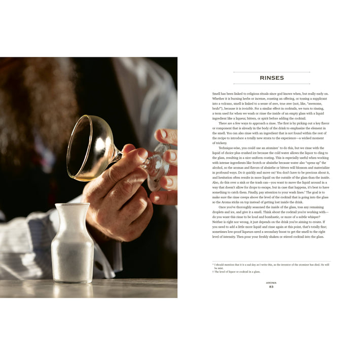 Person pouring liquid from a coupe glass into a white carafe with a page to the right on rinses