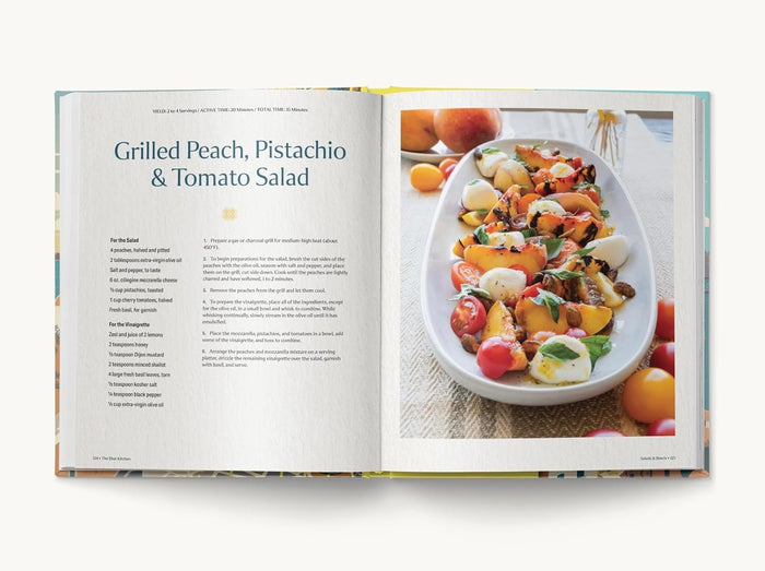 A recipe book oprn to a page for Grilled peach, pistachio, and tomato salad