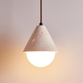 front view of Travessa pendant lit, gray background