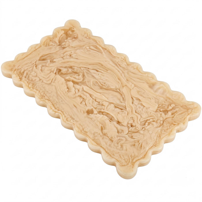 Decorative beige soap with intricate patterns on a white background