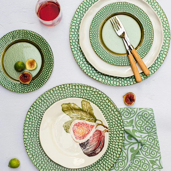 Set of ceramic plates with green rims